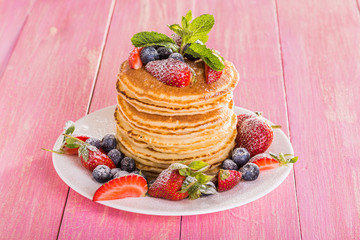 Homemade pancakes with berries and fruit