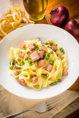 Fettuccine with ham and peas, Italian cuisine
