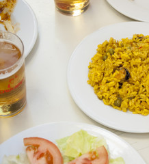 Bowl of rice, salad and beer