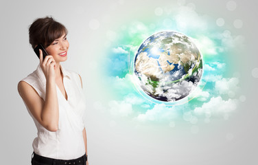Young woman with earth and cloud concept