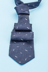 dark blue necktie on blue