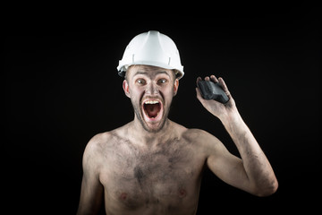 Coal miner on a black background