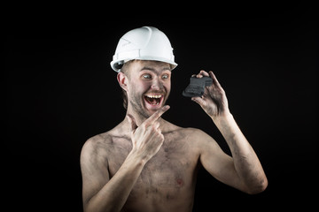Coal miner on a black background