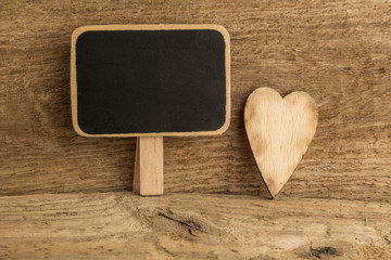 wooden heart and black board