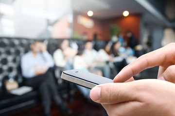 Closeup man hand using smart phone