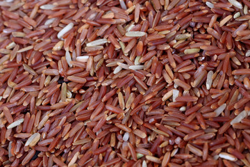 coarse rice or half polished rice background, uncooked raw cerea