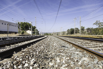 Fototapeta na wymiar Railroad tracks at a station