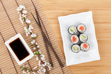 Fototapeta na wymiar Sushi maki set and sakura branch