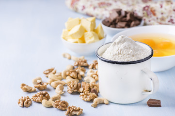 Cup of flour, eggs, butter, nuts and chocolate chunks