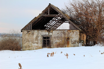 Collapsed old house in winter season