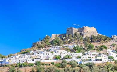 Fototapeta premium The ancient Acropolis of Lindos and the modern city. Rhodes Isla