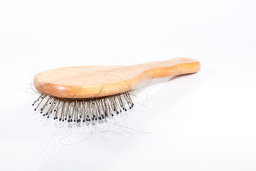 Hair Loss with comb on white background