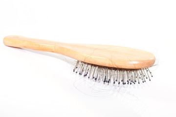 Hair Loss with comb on white background