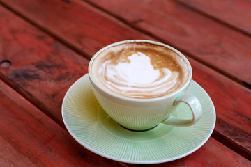 Coffee cup on red table