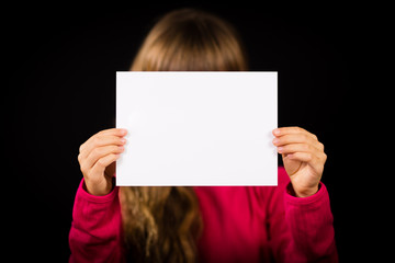 Child with blank white sign