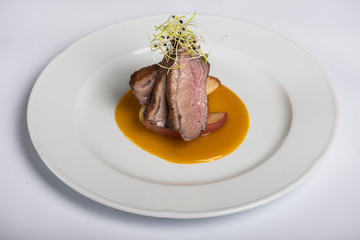 Glazed duck fillet on fried apple and mango sauce