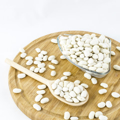 Bean seeds on wooden board. Healthy vegetarian food.