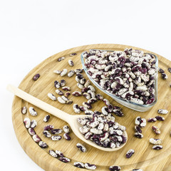 Bean seeds on wooden board. Healthy vegetarian food.