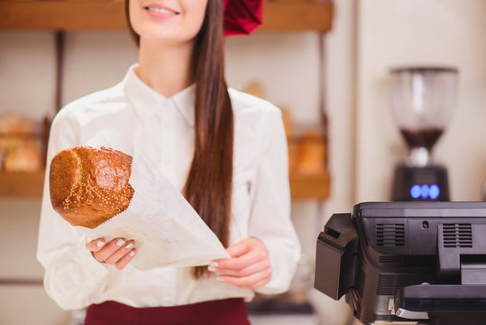 Beautiful young woman in a bakery