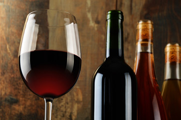 Composition with glass and bottles of wine