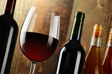 Composition with glass and bottles of wine