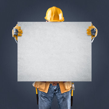 construction worker with information posters on a blue backgroun