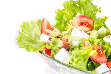 Close up green salad isolated on white