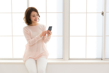 young asian woman using smart phone