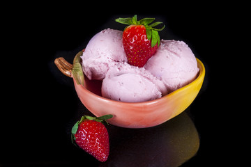 Strawberry ice cream in a bowl.
