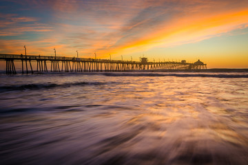 Waves in the Pacific Ocean and the fishing pier at sunset, in Im