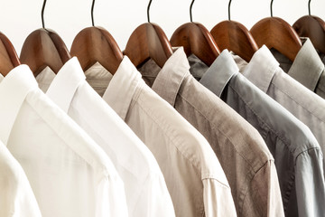 Several shirts on a hanger.
