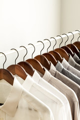 Several shirts on a hanger with copy space