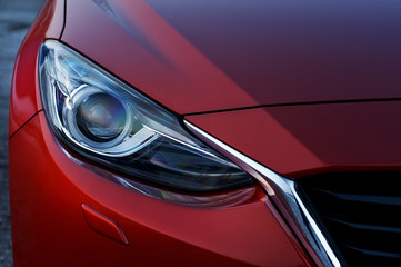 Obraz na płótnie Canvas Red car modern headlight