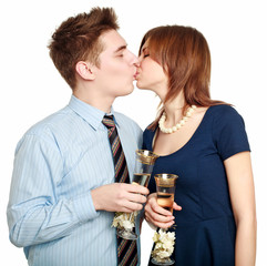 Young couple in love kiss, celebrating a date