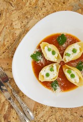 Italian pasta with ricotta cheese,green peas,and salsa