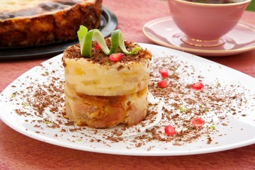 A piece of cheese cake with pears. Top view