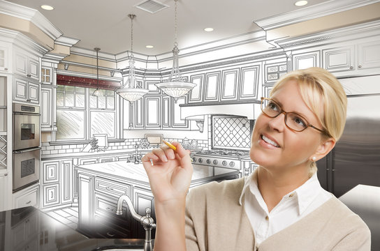 Woman With Pencil Over Custom Kitchen Design Drawing and Photo C