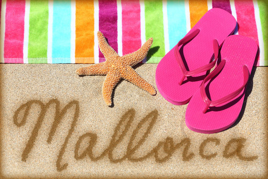 Mallorca beach vacation writing on sand