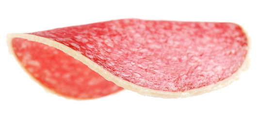 Slice of salami isolated on white background