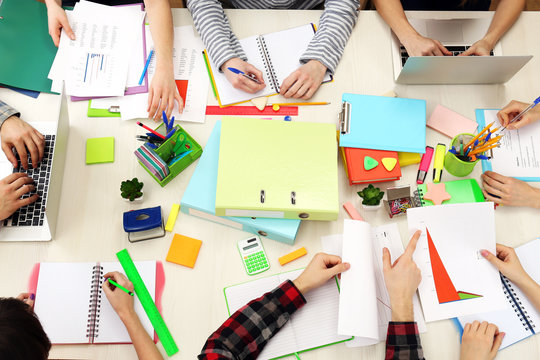 Group Of People Working At Desk Top View