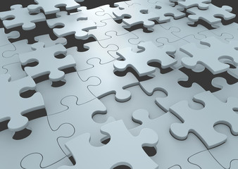 Puzzle pieces connecting to form a solution to a challenge
