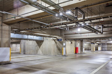 Parking garage underground interior, neon lights in dark