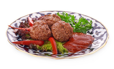 Meat on a grill with vegetables