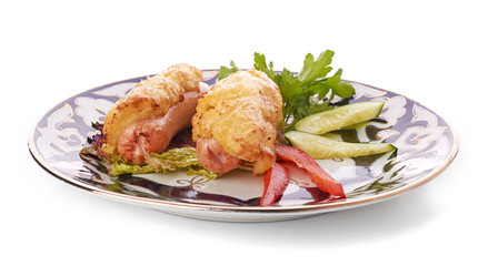A pile of chicken nuggets on white plate with sauce