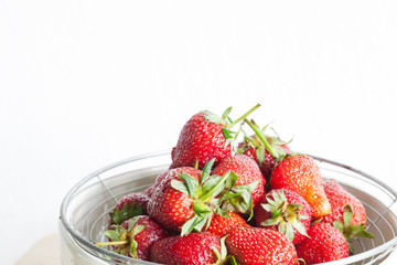 Fresh Organic Long Stem Strawberries in a Bowl.
