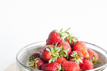 Fresh Organic Long Stem Strawberries in a Bowl.