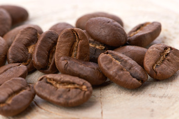 Coffee beans on wood background