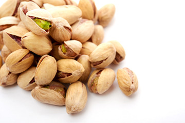 Heap of pistachios nuts isolated on the white