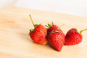 Fresh strawberry on wood.