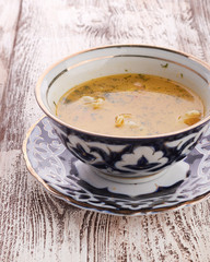 Bowl of chicken soup with vegetables and noodles